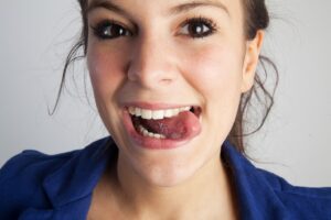 Adult woman sticking out her tongue