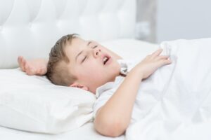 Child sleeping with mouth open. 