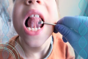 Dentist checking out child with tongue tie. 