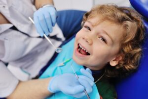 Young boy at the dentist smiling